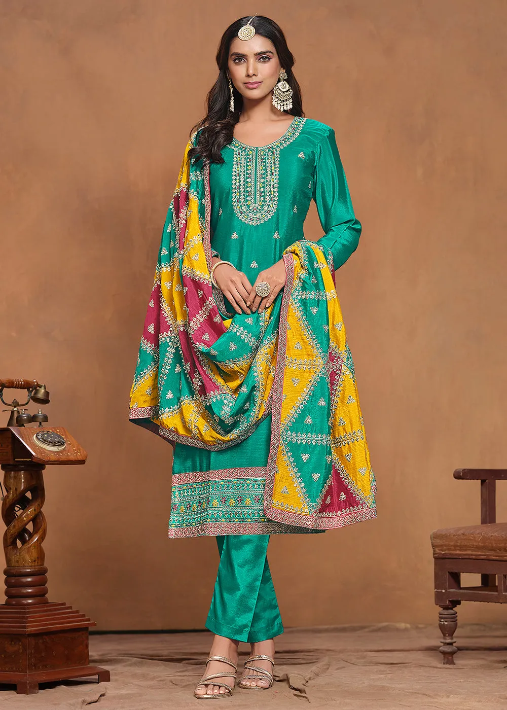 Chinnon Silk Turquoise Salwar Suit with Triangular Patch Dupatta