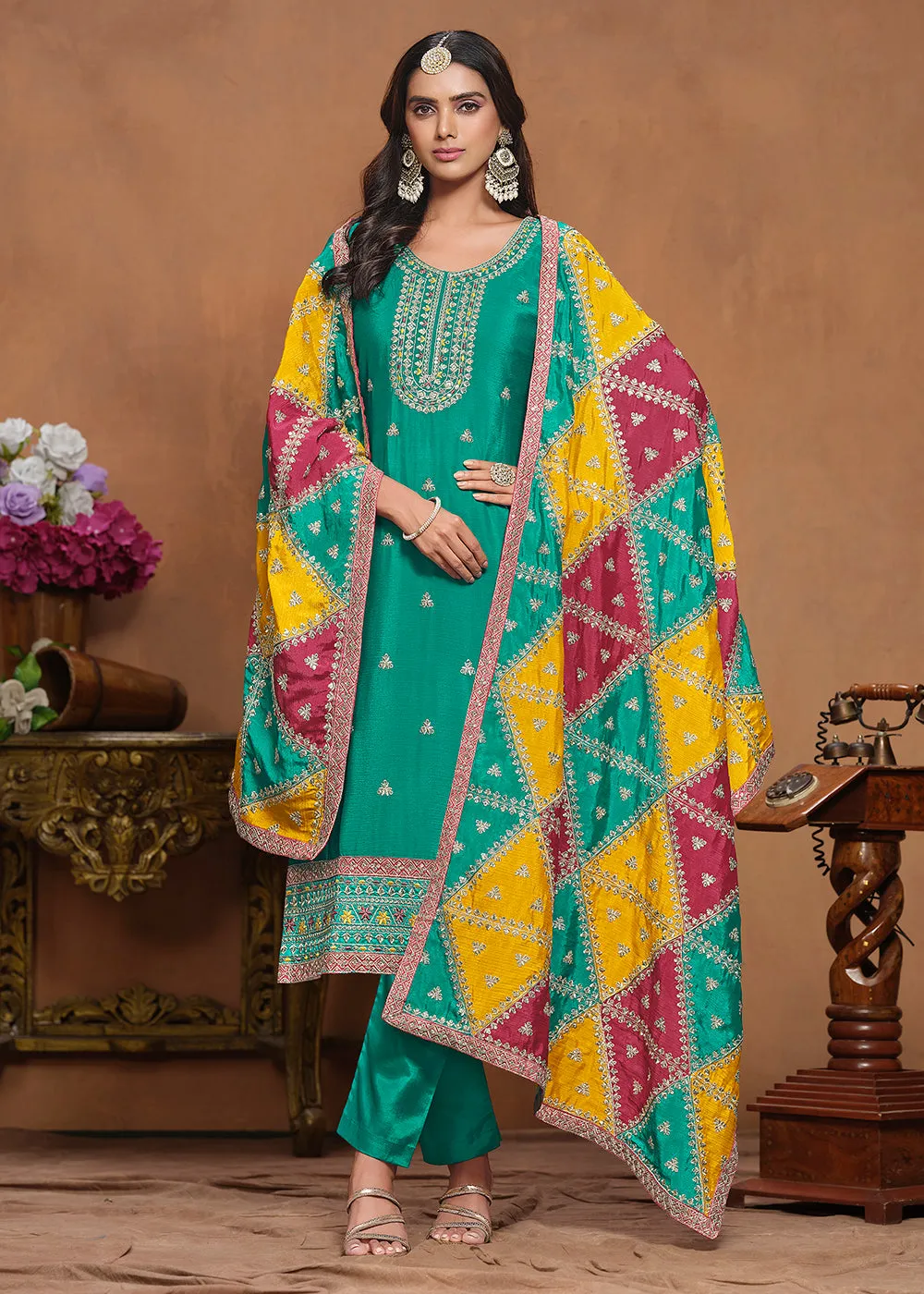 Chinnon Silk Turquoise Salwar Suit with Triangular Patch Dupatta